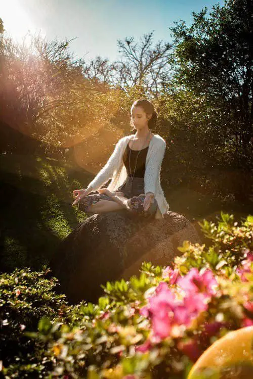 woman meditating in nature