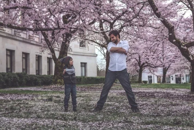 father and daughter playing outside