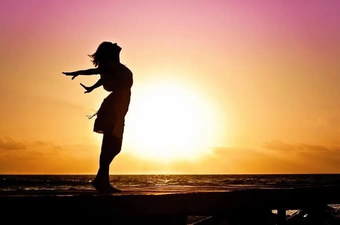 girl enjoying sunrise