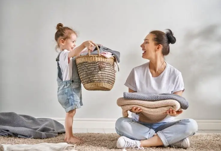 little girl helping with mom