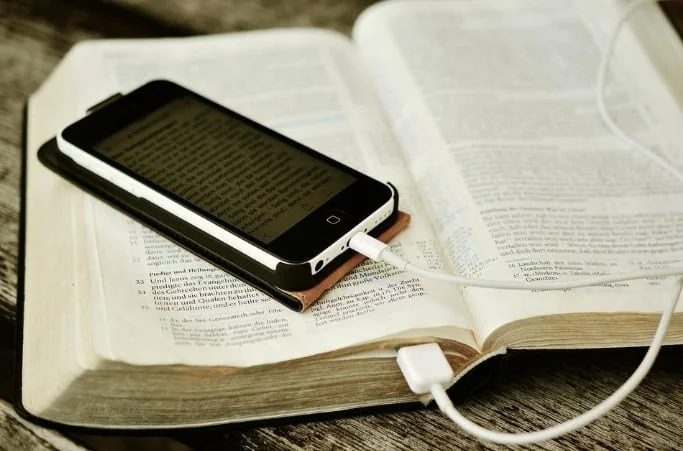 mobile placed on bible