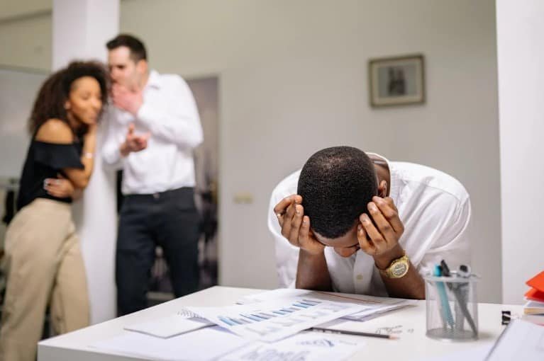 people laughing at black collegue