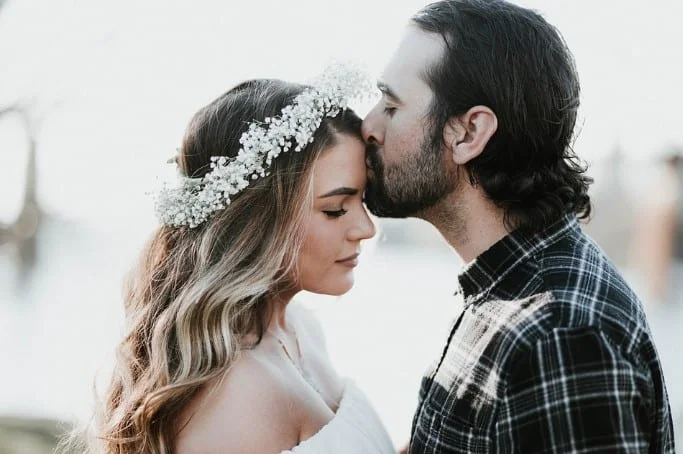 grrom kissing bride after marriage