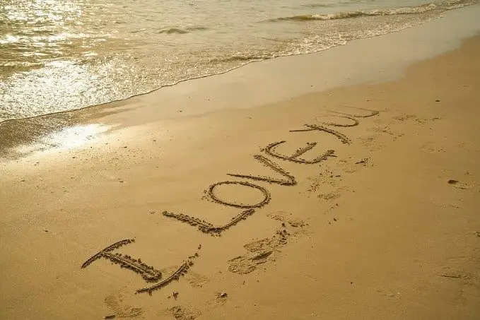 i love you written on sand