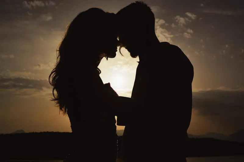 romantic couple silhouette during sunset