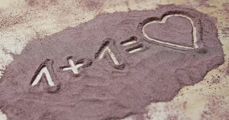 love equation written on sand