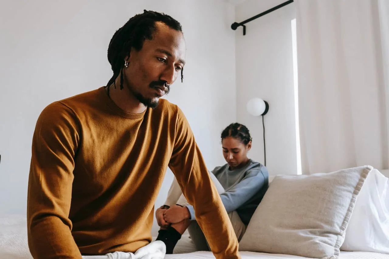 upset couple during dispute in bedroom