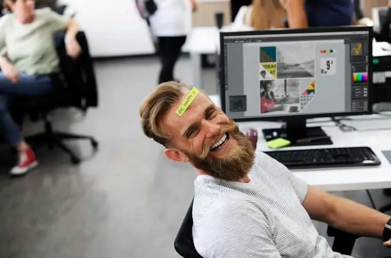 happy bearded male with happy note on forehead