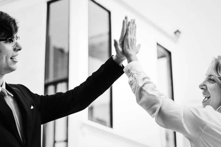 business people giving a high five