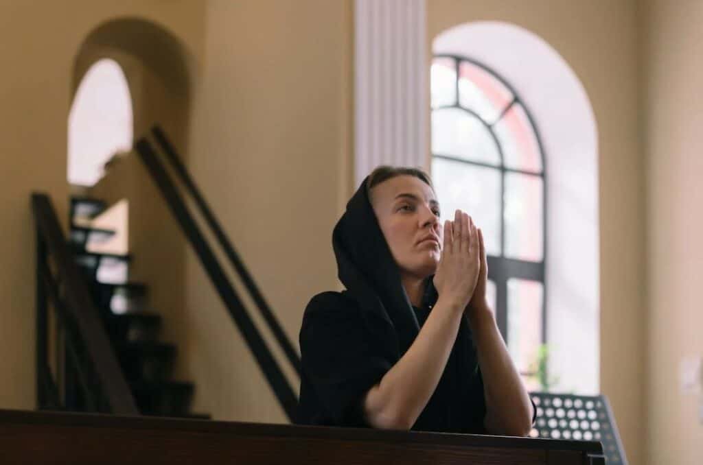 woman praying in the church