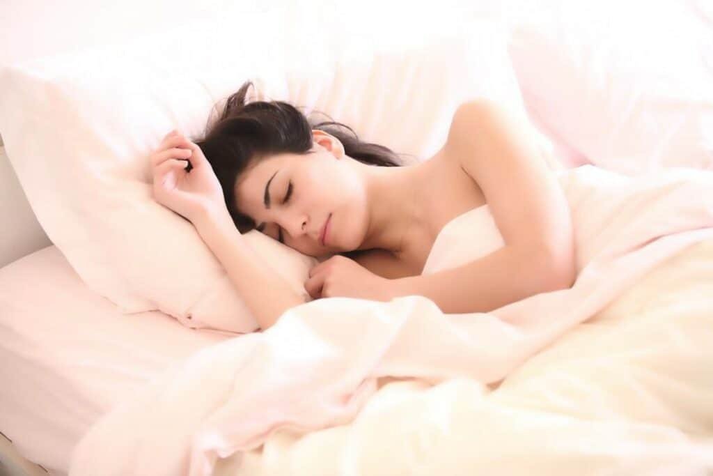 woman sleeping on a cozy bed