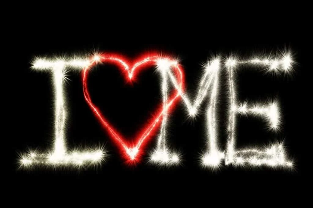 “I Love Me” neon sign with a heart shape in the center