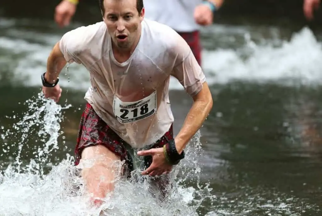 man participating in an obstacle race