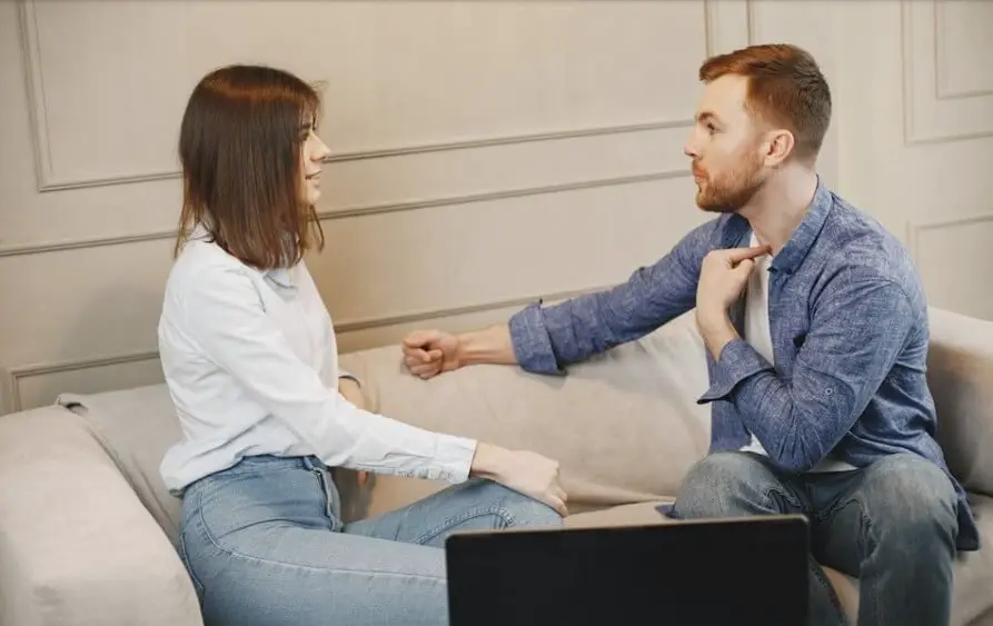 couple talking in the couch