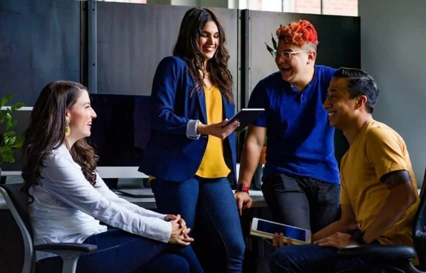 group of happy coworkers in office