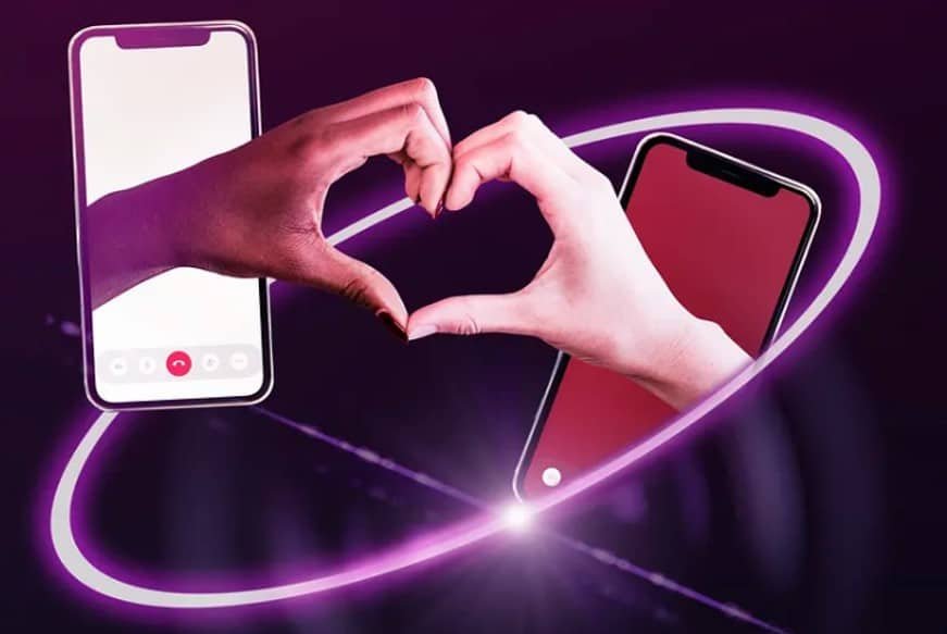 smartphone with hand forming heart sign