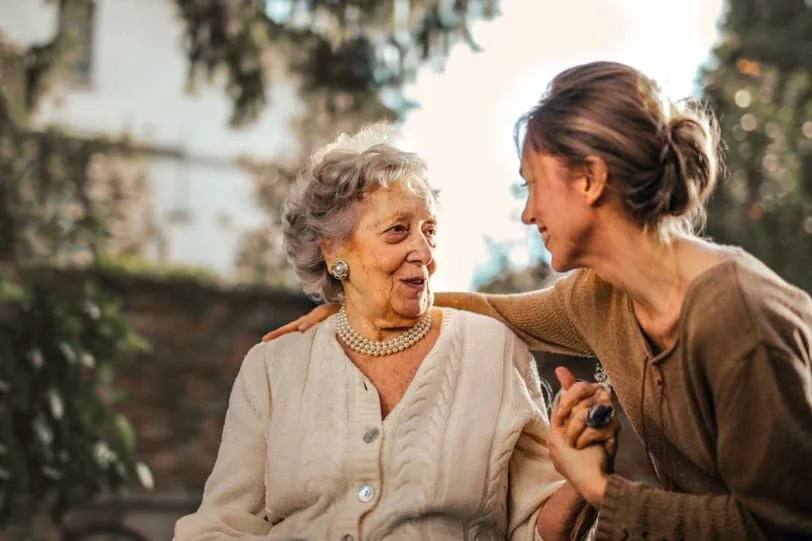 women talking to young lady