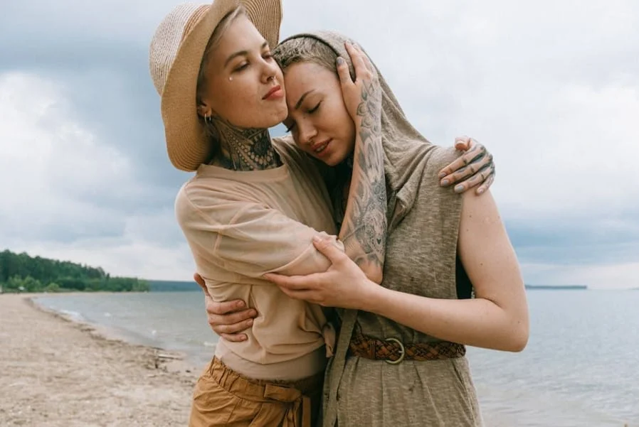 Woman comforting friend