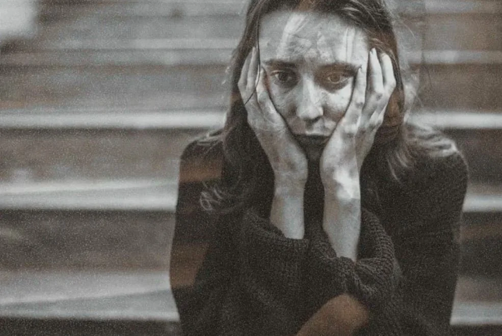 Distressed woman on a staircase