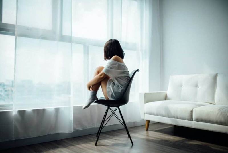 Lonely woman on a chair