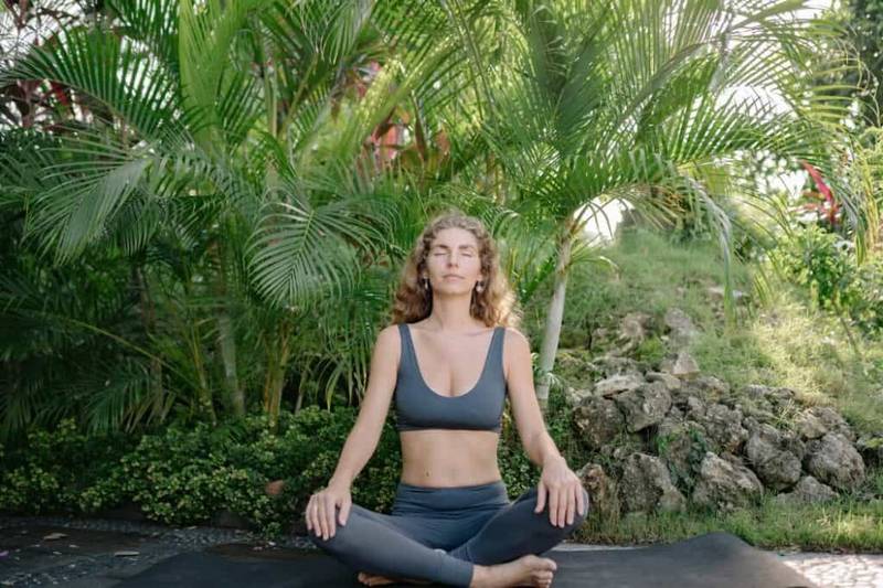 Woman meditating outdoors