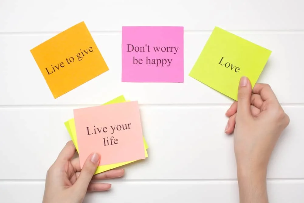 hand lays out motivational cards