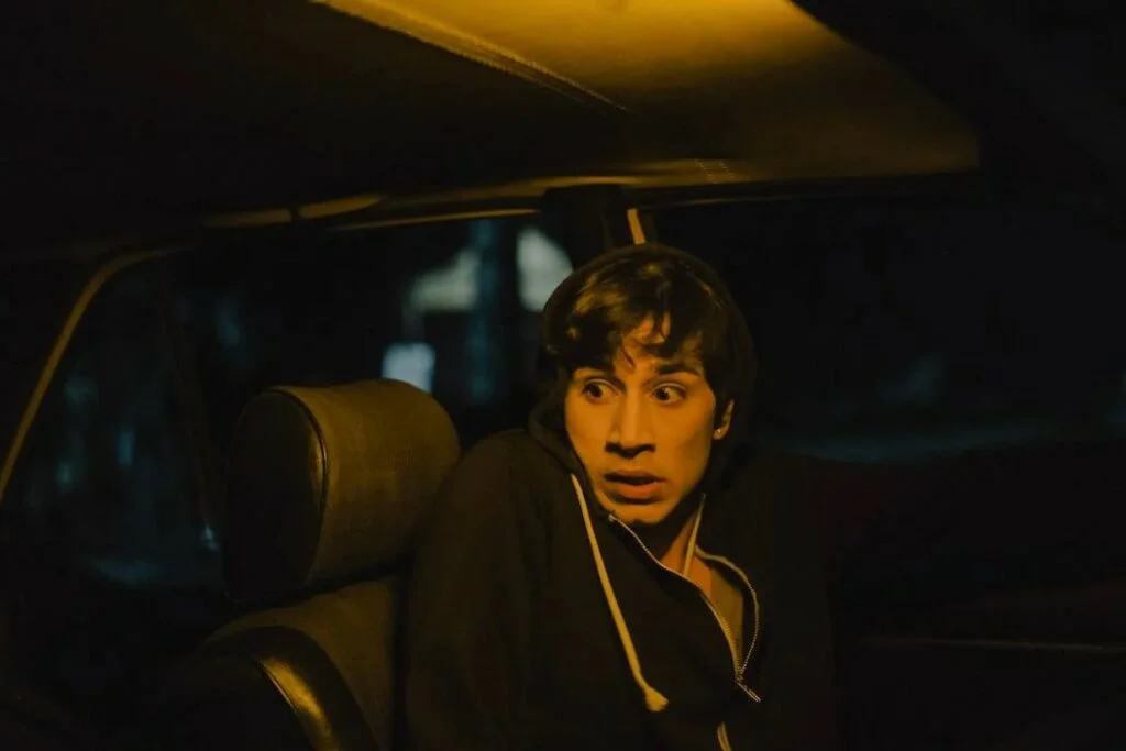 Frightened man inside a car.png