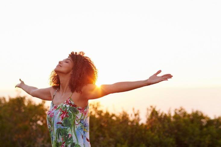 Woman raising both hands