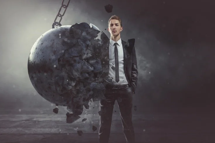 Man standing firm against a wrecking ball