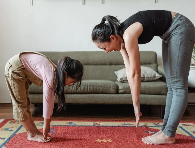 Mother and daughter doing exercise