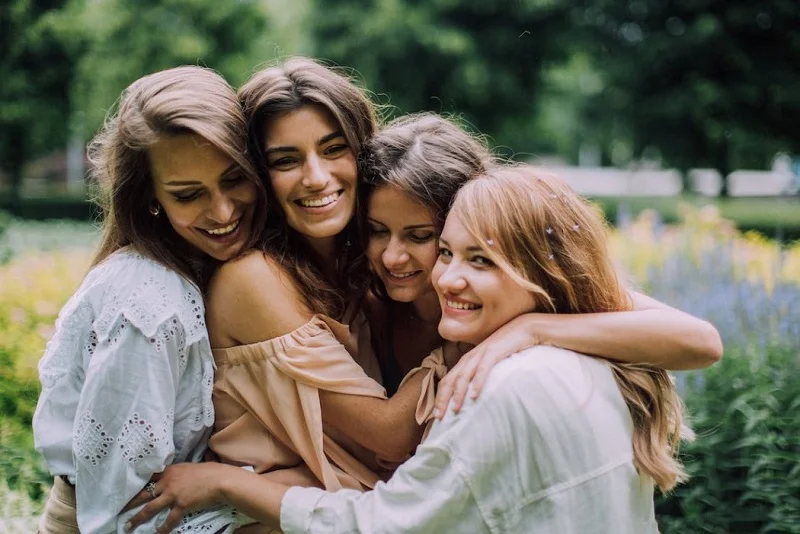 Women hugging and smiling